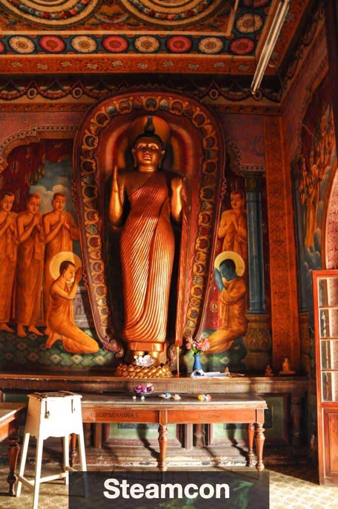 Wooden Tables Inside Building With Statue