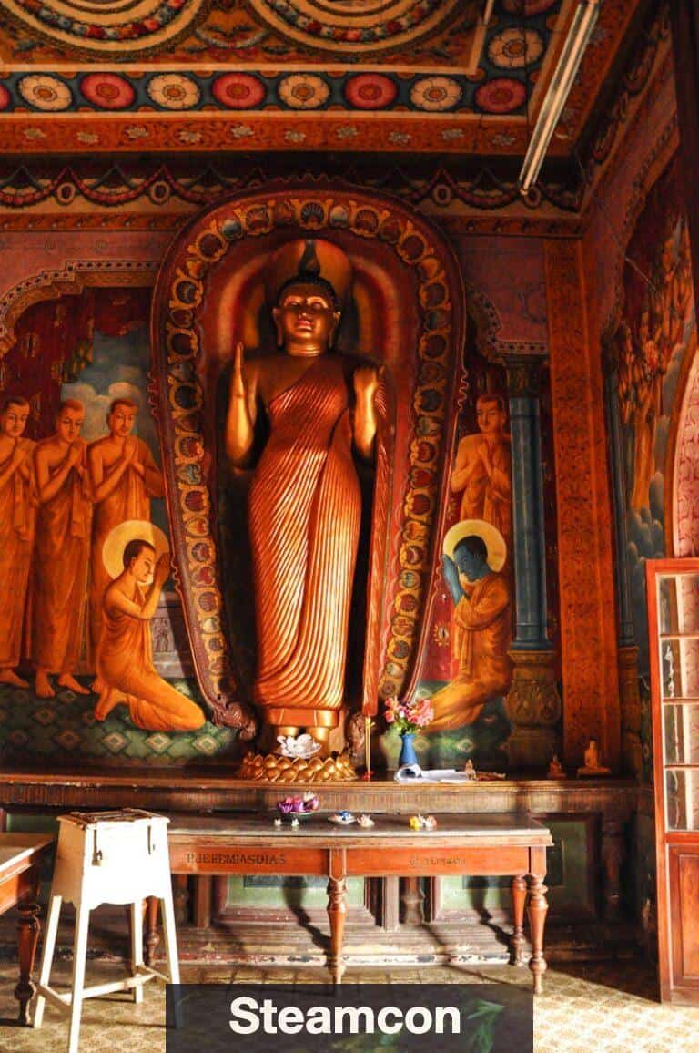 Wooden Tables Inside Building With Statue
