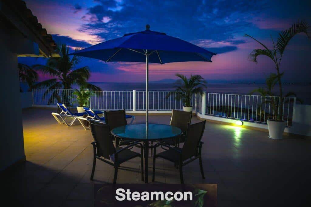 Round Metal Patio Near Railings at Night