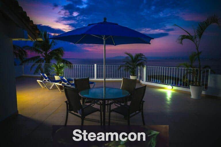 Round Metal Patio Near Railings at Night