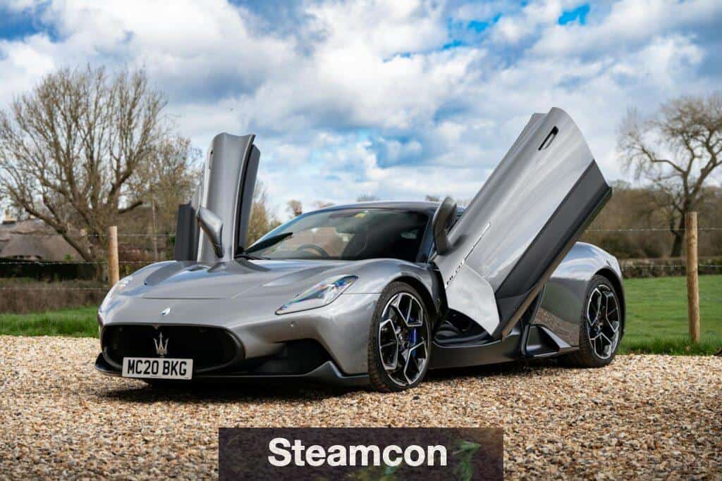 Silver Maserati MC20 with its Butterfly Doors Open