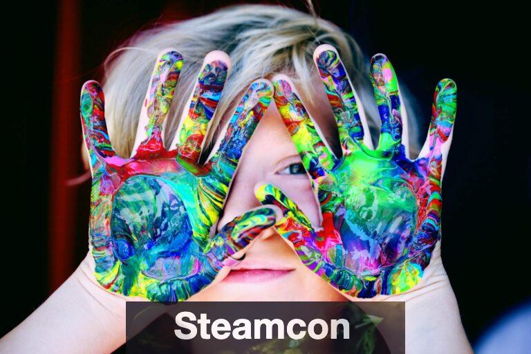 Vibrant close-up of a child's hands covered in colorful paint, expressing creativity and fun.