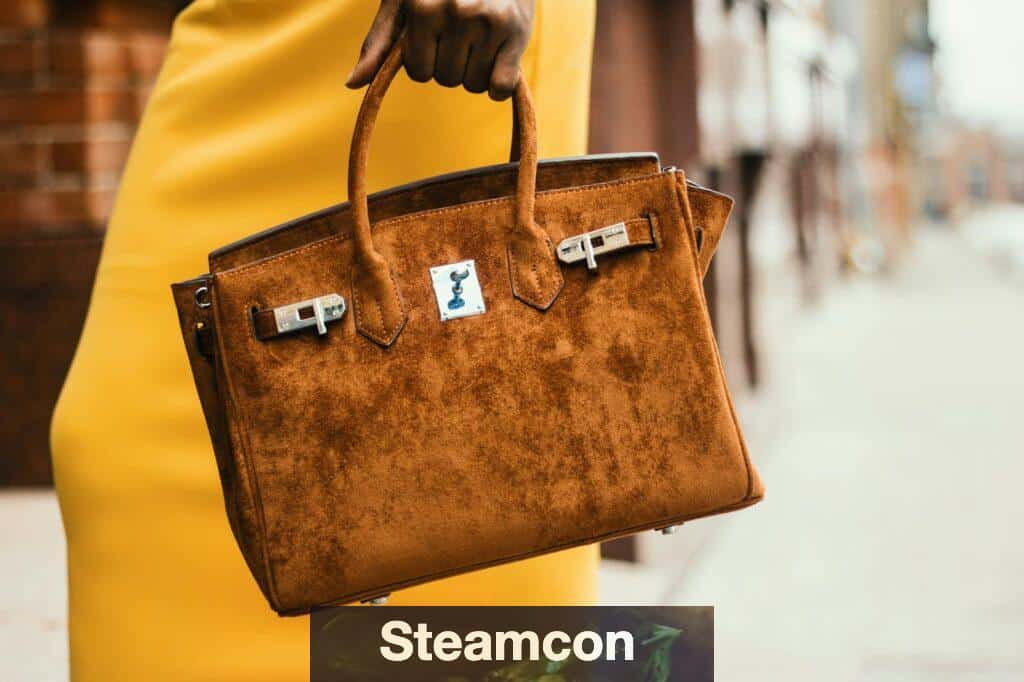 Chic brown leather handbag held by a fashionable woman in a vibrant cityscape.