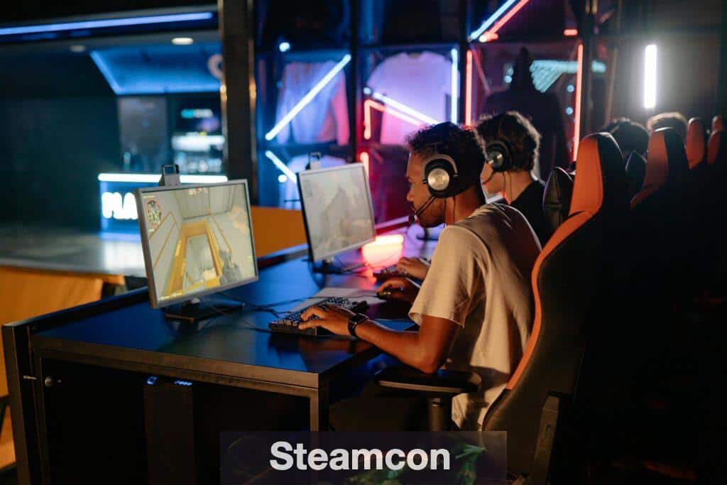 Competitive gaming session with friends indoors featuring high-tech computers and neon lights.