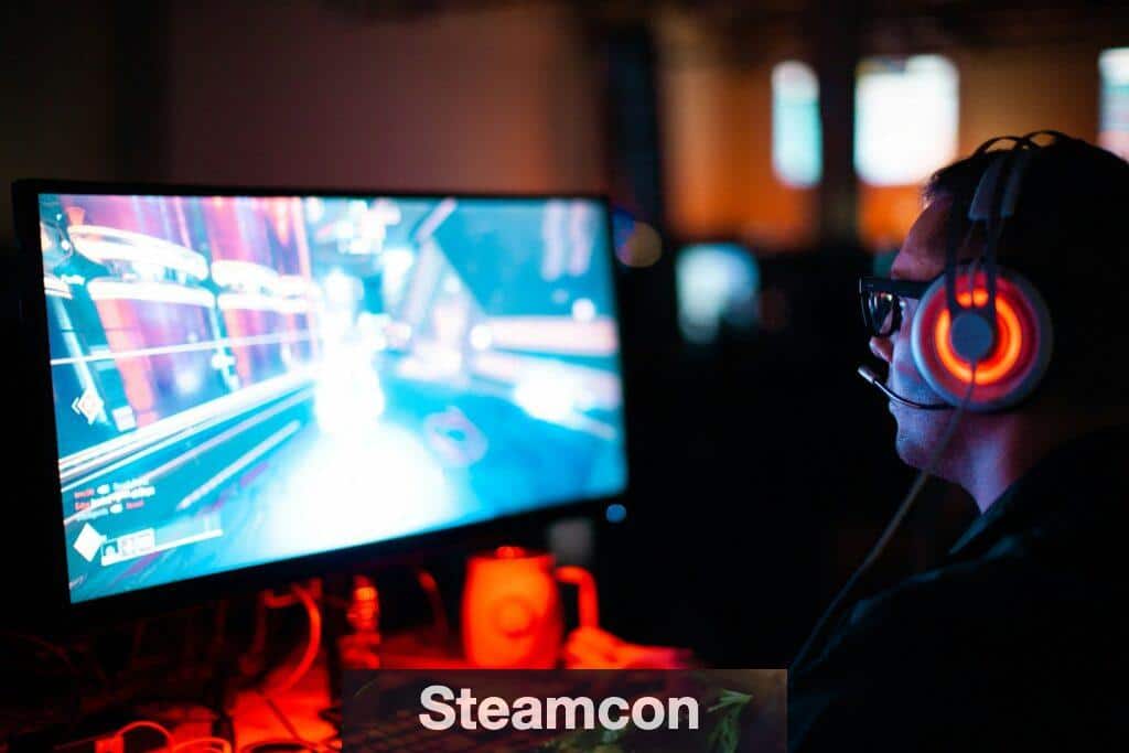 person using computer playing FPS game