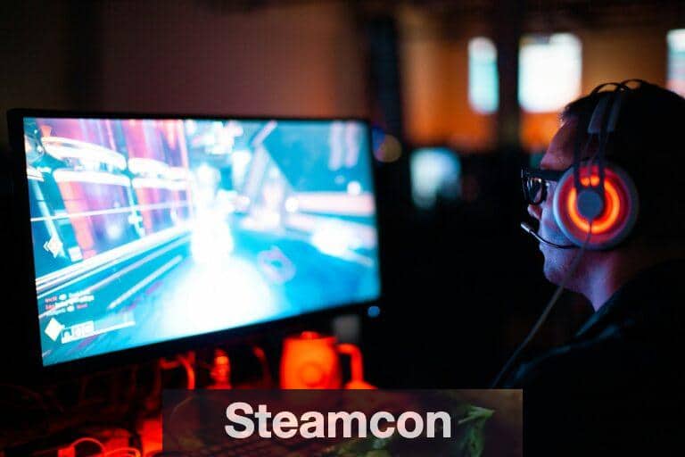 person using computer playing FPS game
