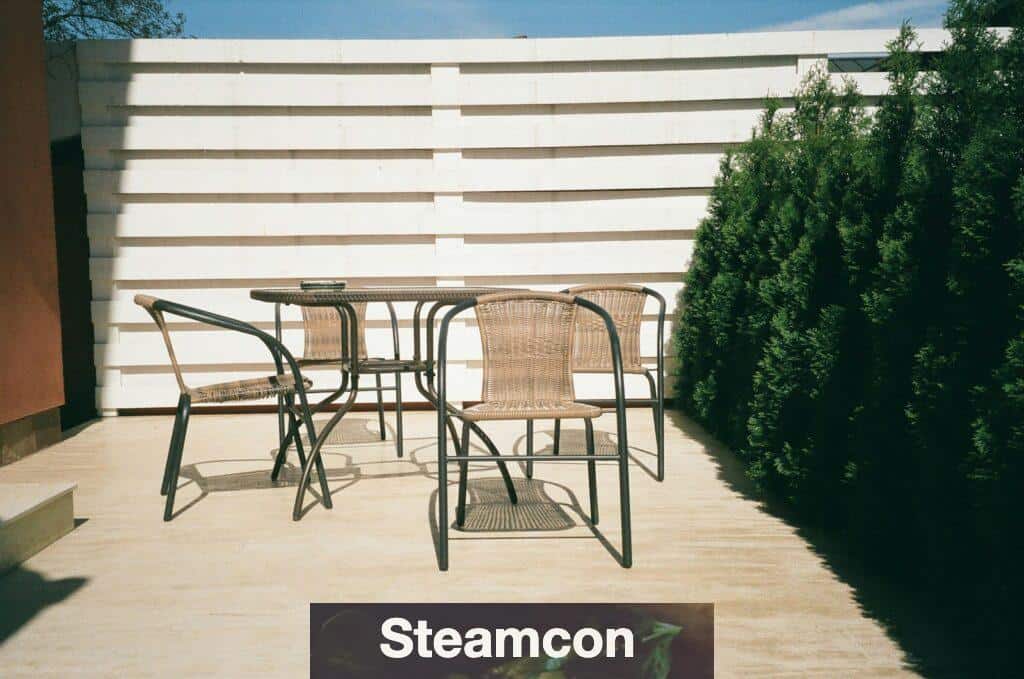 black metal framed white wooden table and chairs