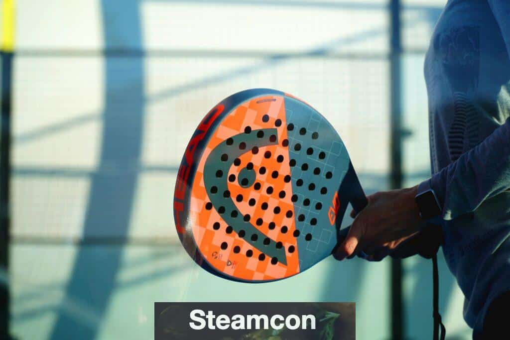 person holding orange and white polka dot round ball