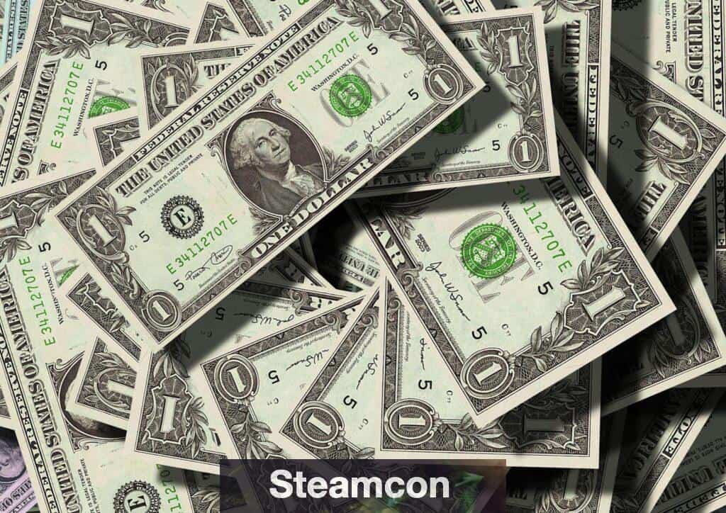 Close-up of scattered US dollar bills symbolizing finance and wealth.