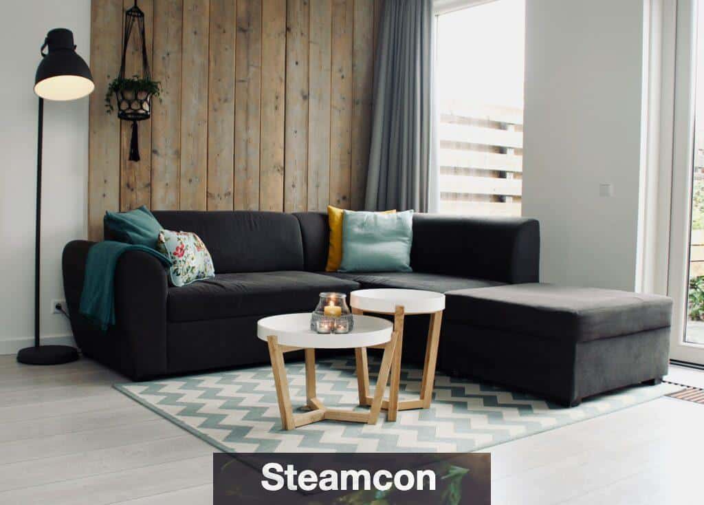 light candle on round white coffee table and sectional sofa